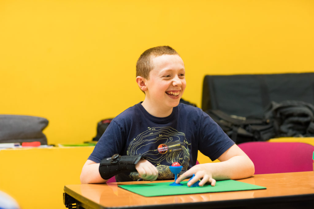 HemiHelp event - smiling teenager sitting at table