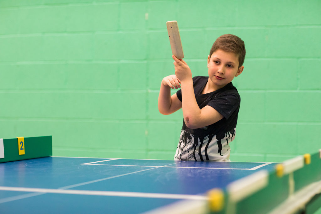 HemiHelp event - teenager wearing black t-shirt playing table cricket