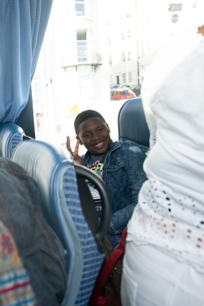 Young adult sitting on coach