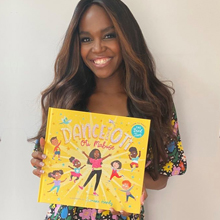Oti with a copy of her book