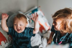 Happy toddler with hands in air