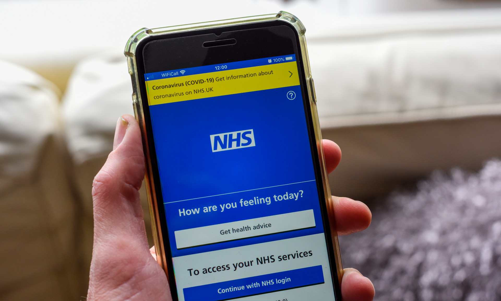 Photo of smartphone showing NHS app homescreen