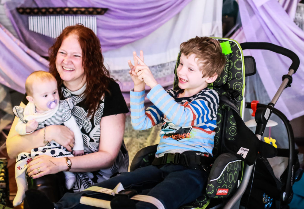 Mum with baby and child in wheelchair