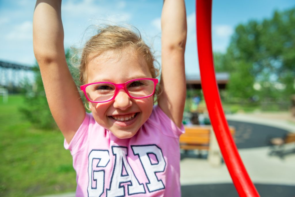 Happy young girl wearing glasses