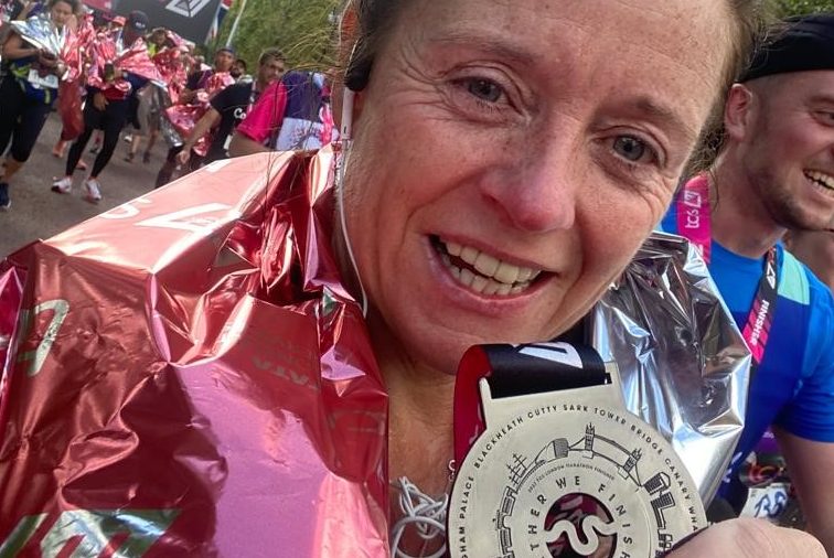 London Marathon runner Louise holding her medal