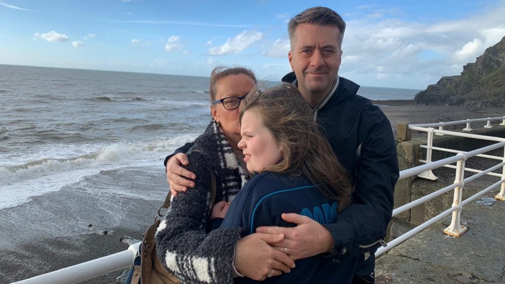 Lucy and son Flynn with dad at the seaside