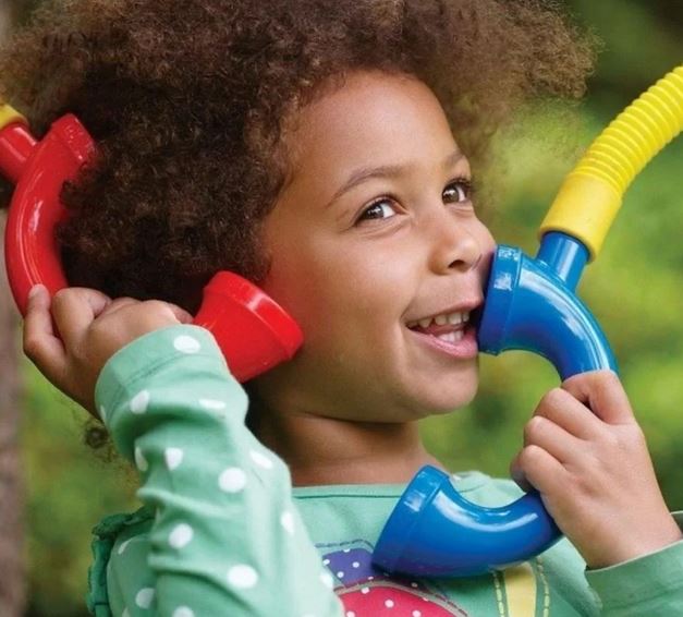 Child playing with telephone toy