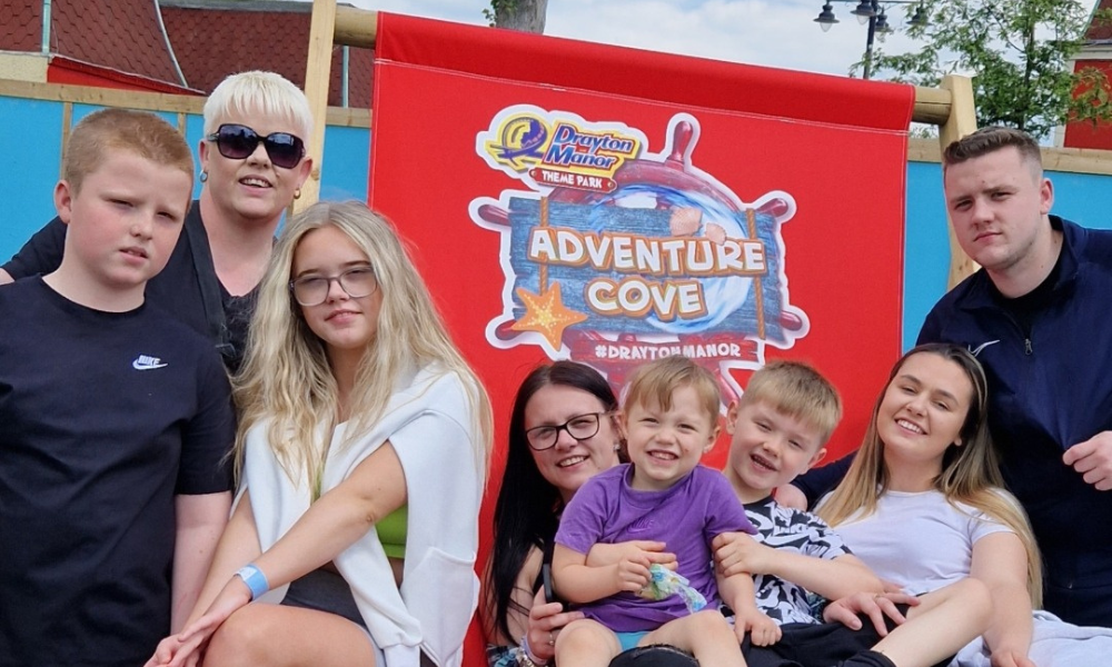 Lottery winner, Marie from Birmingham at a theme park with her children.