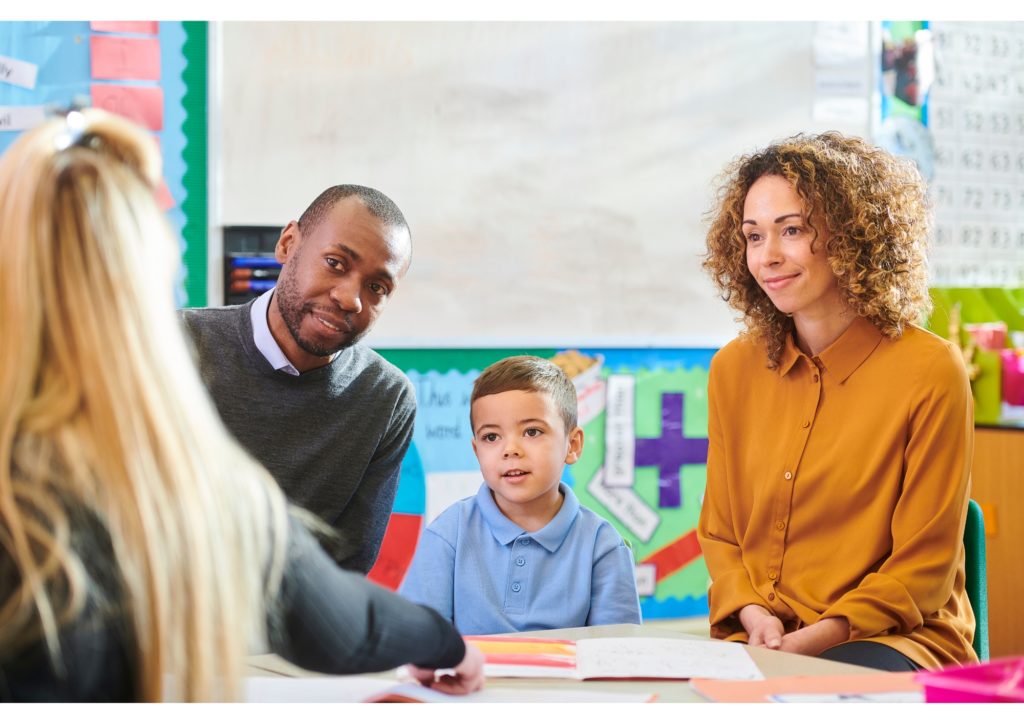 Parents with child meeting practitioner