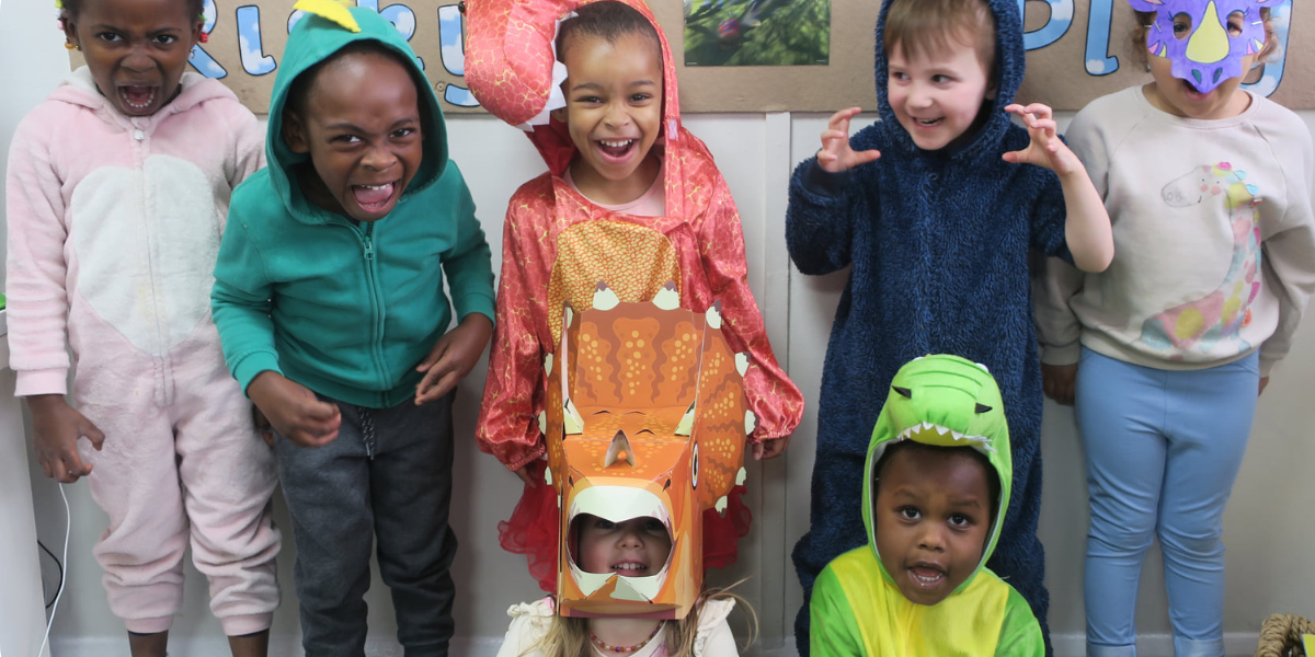 Lots of children dressed up in dinosaur costumes as part of DinoDay