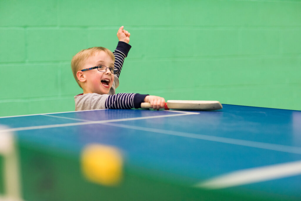 Boy playing bat and ball game