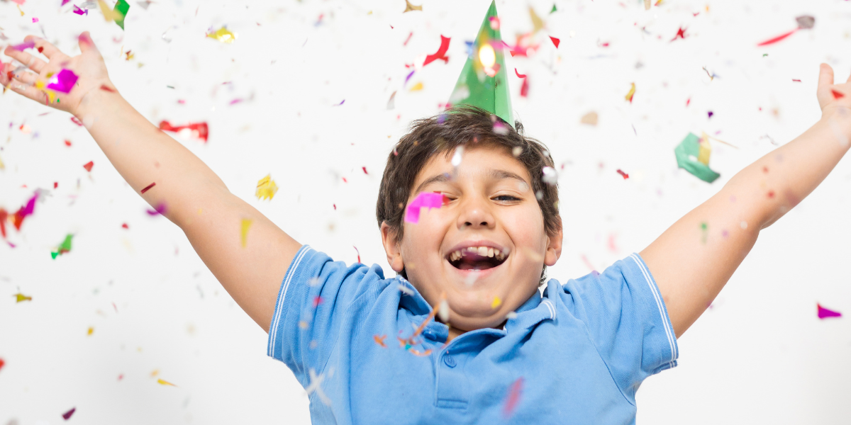 Child celebrating in a cloud of confetti after parent wins the lottery