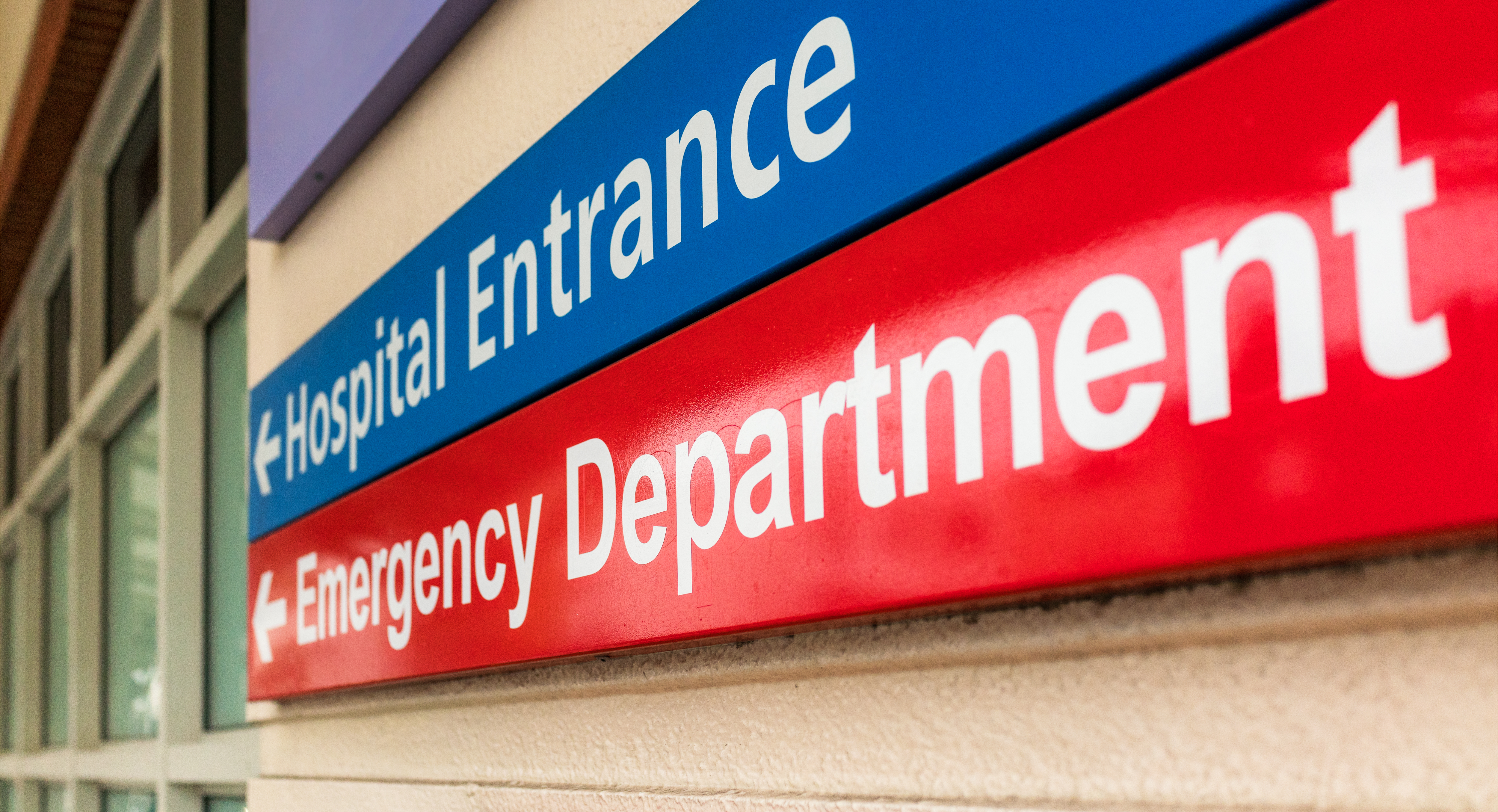 Hospital entrance and emergency department sign