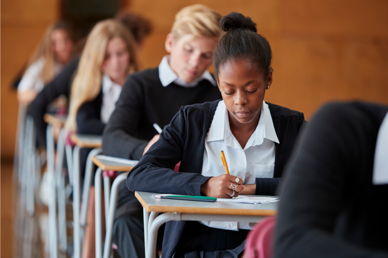 Teenager school pupils taking exam