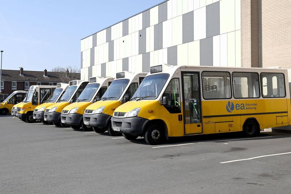 A row of yellow School Buses in Northern Ireland
