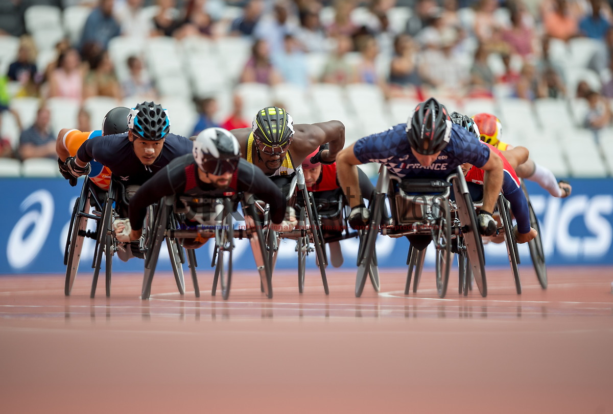 Paralympic wheelchair race competitors seen front-on