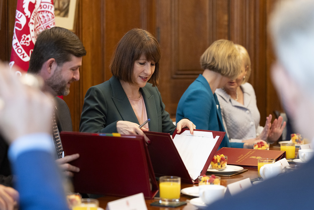 Chancellor Rachel Reeves opening a red file