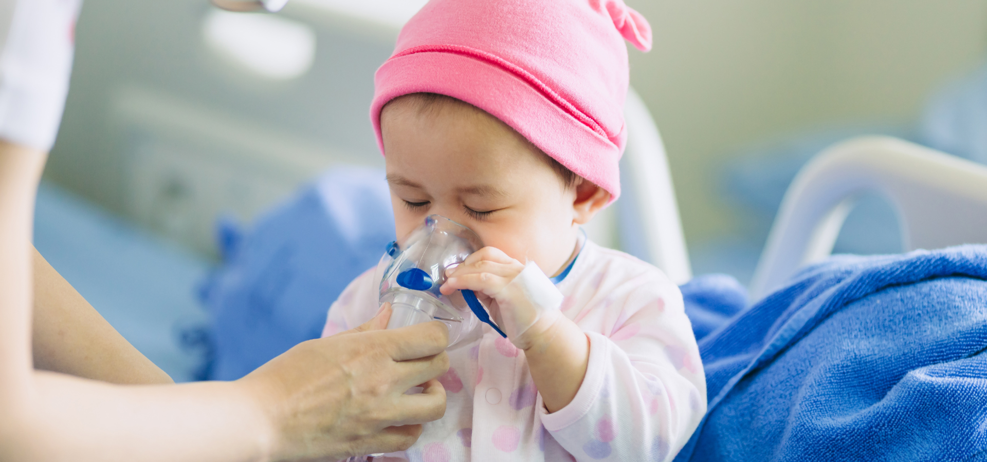 Young baby using oxygen machine in hospital