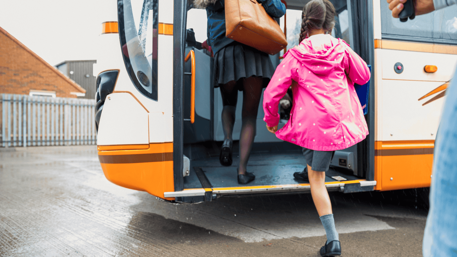 Children getting onto a bus