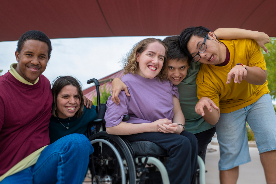 A group of disabled teenagers posing for the camera