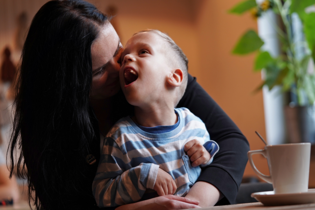 Mum and child hugging each other